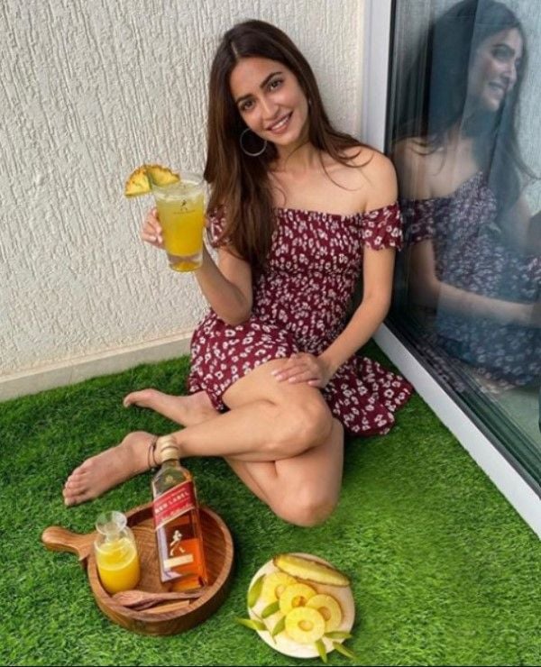 Kriti Kharbanda having an alcoholic drink