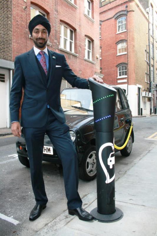Kulveer Ranger posing with a electric car charging point in Magdalen Street