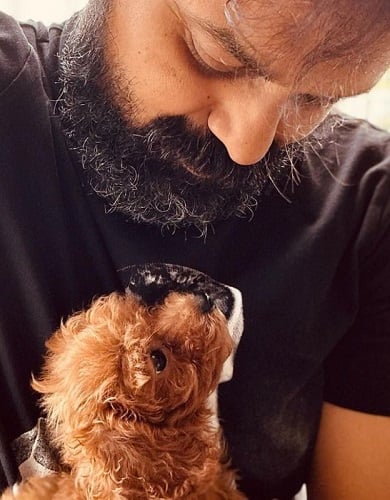 Kunchacko Boban with his pet dog