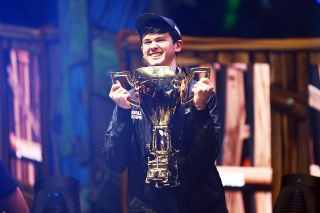 Kyle Giersdorf with the World Cup Trophy