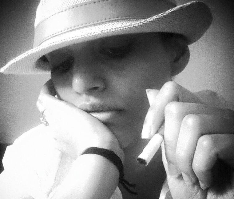 Kyra Dutt posing with a cigarette