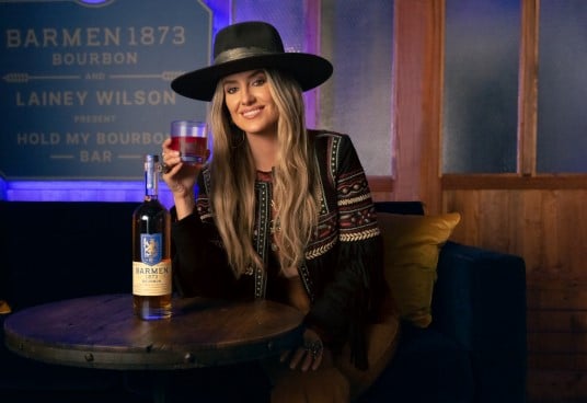 Lainey Wilson while enjoying an alcoholic beverage