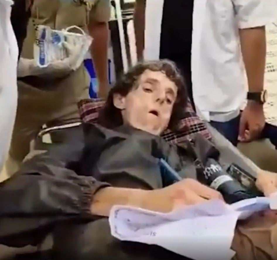 Lalita Kayi writting a note in the hospital