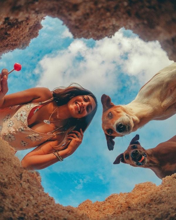 Larissa posing with her dogs