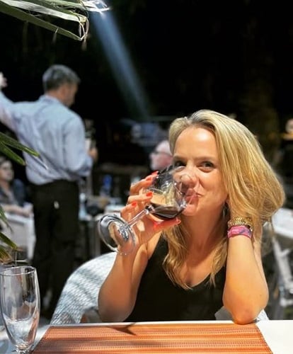 Laura Aikman drinking wine