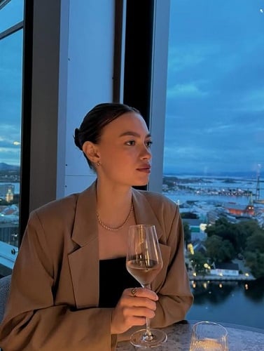 Lea Irene Larssen holding a glass of wine