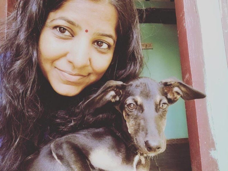 Leena Manimekalai with a dog