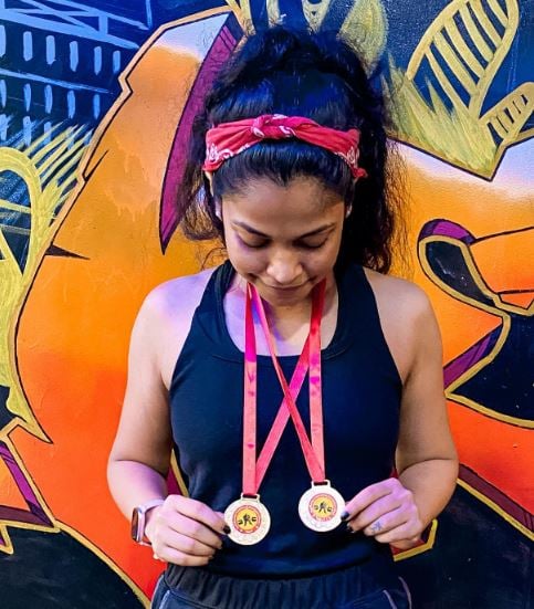 Lekha Jambaulikar wearing her gold medals