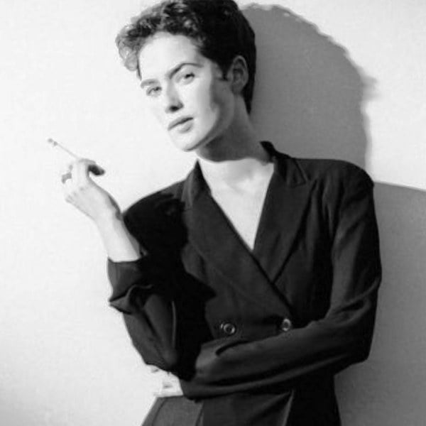 Lena Headey while holding a cigarette