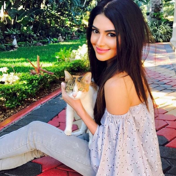 Lerisha Munsamy playing with a cat