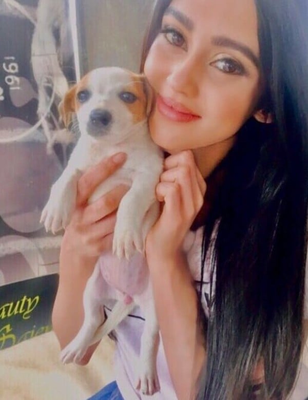 Lerisha Munsamy playing with a dog