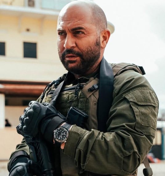 Lior Raz posing in army uniform