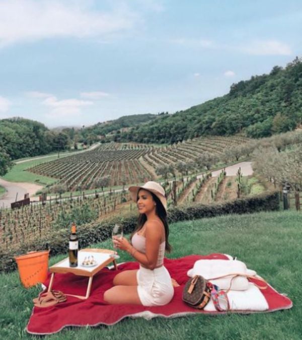 Lisa Morales enjoying wine at a winery in Istria