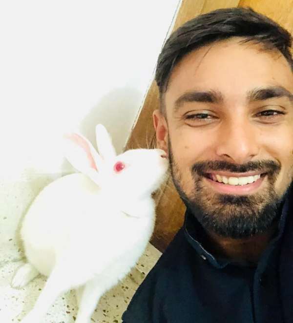 Litton Das playing with a rabbit