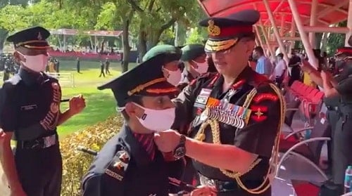 Lt Gen Y K Joshi putting the rank badges on Nitika Kaul