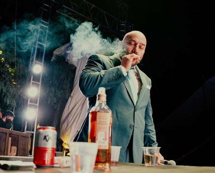 Lupillo Rivera smoking and drinking during a live performance