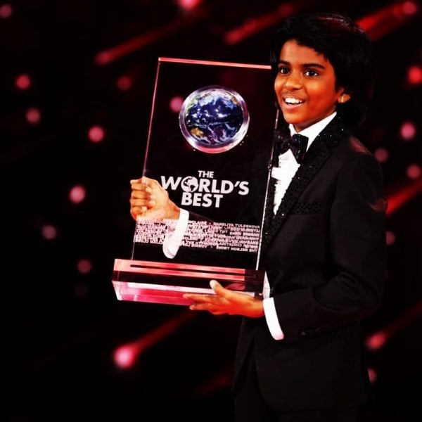 Lydian Nadhaswaram with the trophy of the talent show