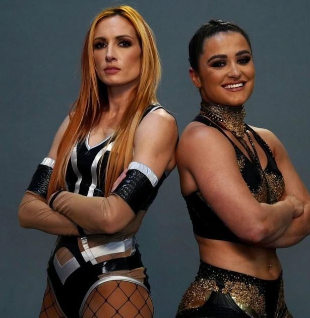 Lyra Valkyria with Becky Lynch (left) before their match