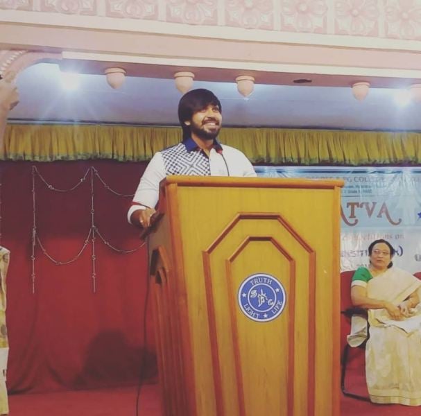 Maanas while delivering a speech at St. Pious College in Tarnaka in 2018