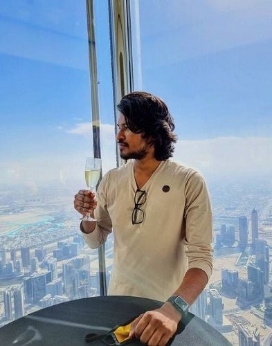 Madan Gowri drinking white wine