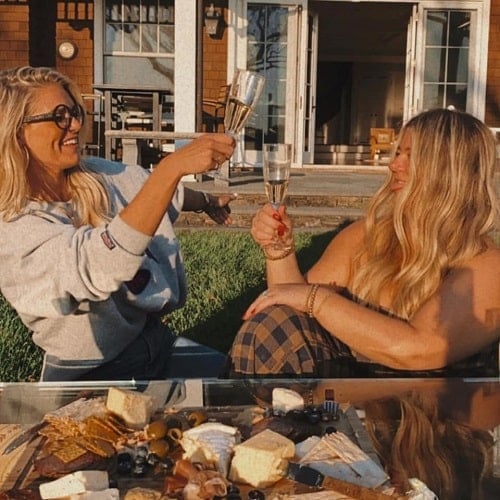 Madison LeCroy holding a glass of wine