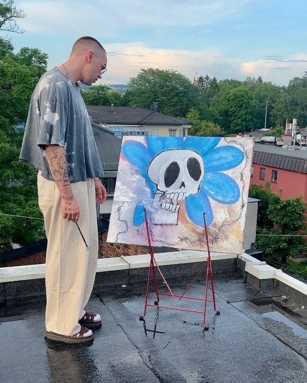 Magnus Pedersen while painting on the roof