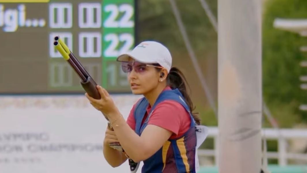 Maheshwari Chauhan holding her shotgun at the ISSF Olympic Qualification Championship