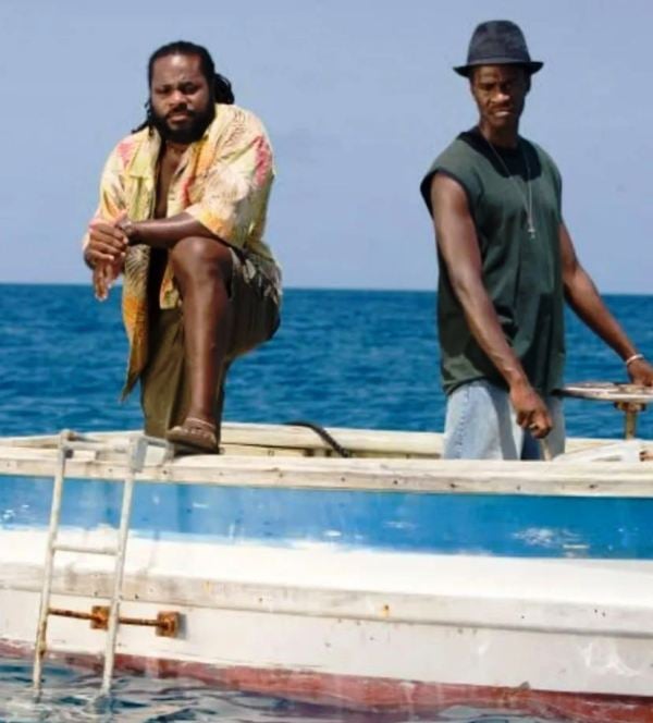 Malcolm-Jamal Warner (left) as 