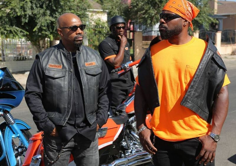 Malcolm-Jamal Warner (right) as 