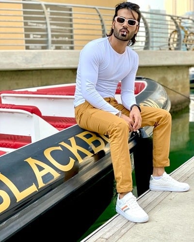 Malik Aqeel smoking a cigarette