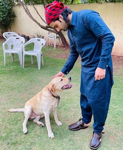 Malik Aqeel with his pet dog