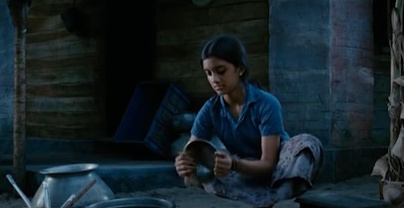 Malvika Nair in a still from the film Puthiya Theerangal and Karmayodha (2012)