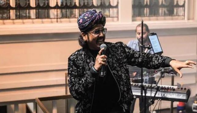 Mame Khan performing at a concert