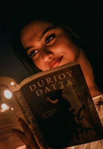 Mamitha Baiju reading a book