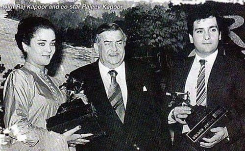 Mandakini holding her award