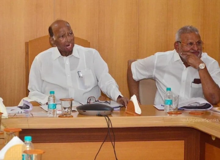 Manikrao Kokate, while sitting with Sharad Pawar (right)