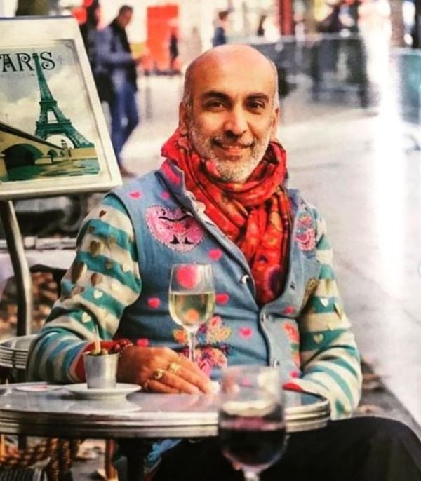Manish Arora with a glass of wine