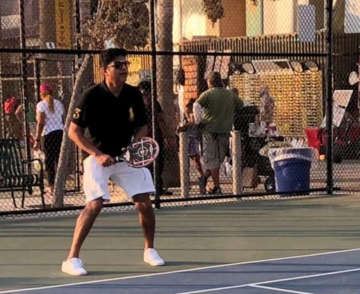 Manish Chowdhary playing tennis