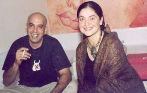 Manish Makhija holding a cigarette