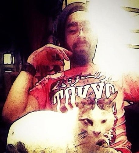 Manjot Singh with a cat