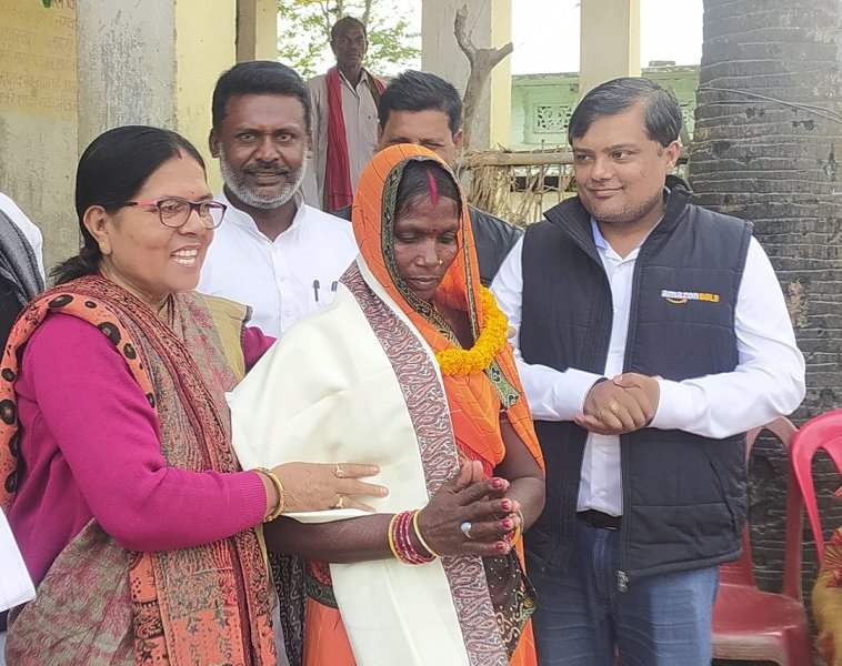 Manju Verma (left) with her son, Abhishek Anand, (extreme right) during a program of Anand Yuva Shakti self-help group