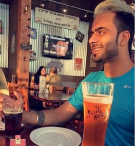Mankirt Aulakh drinking beer