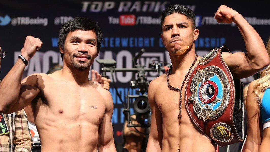Manny Pacquiao and Jessie Vargas (right) during the weigh-in before their fight