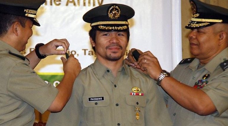 Manny Pacquiao (middle) after becoming a colonel in the reserve force of the Philippine Army