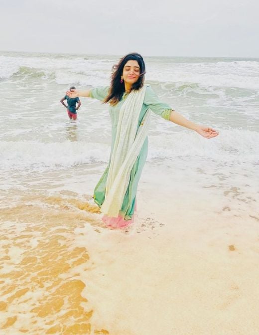 Manosi enjoying on a beach