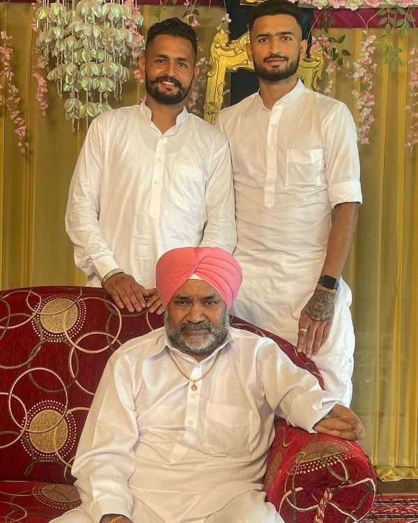 Manvir Singh with his father and brother