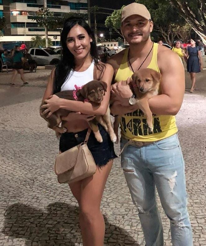 Marcelo Prata with his wife and pet dogs