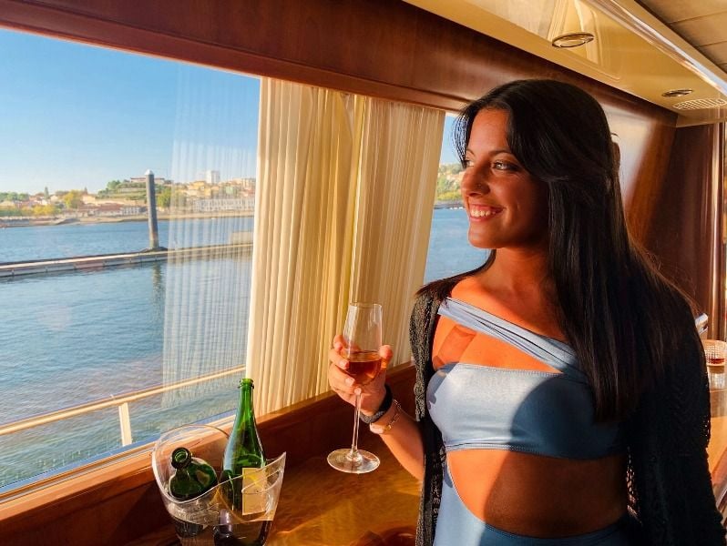 Maria Craveiro while having champagne