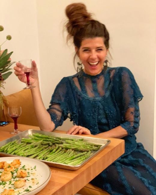 Marisa Tomei holding a glass of wine
