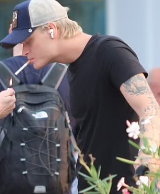 Marius Borg Høiby while smoking a cigarette